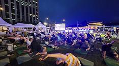 Body and Seoul: downtown yoga class attracts 200 attendees