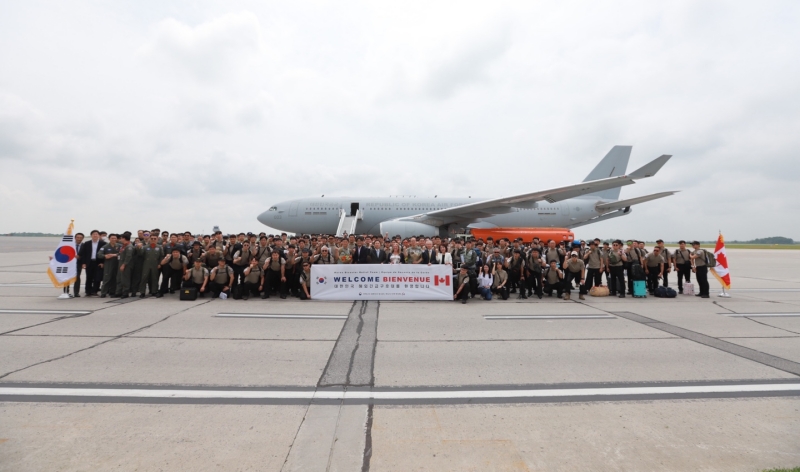 The 151-member Korean Disaster Relief Team dispatched to help fight wildfires in Canada on July 2 pose for a group photo upon arrival at Ottawa International Airport. (Ministry of Foreign Affairs)